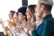 © tunedin - Businesswomen clapping hands during a training