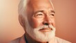 © iuricazac - Joyful elderly gentleman posing against a well-lit studio backdrop.