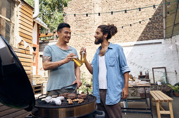 Friends preparing meat for a barbecue in the backyard