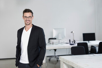 Wall Mural - Portrait of a young businessman in his office