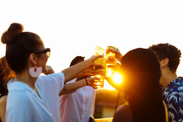 Poster - Group of happy multi-ethnic friends celebrating a party in the evening