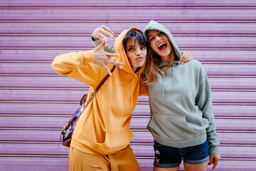 Portrait of two smiling and hugging female friends