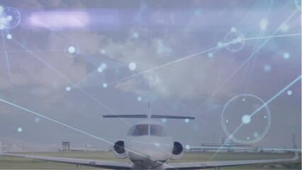 Canvas Print - Animation of connected dots over parked airplane against cloudy sky at airport