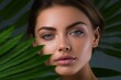 Generative AI : Young beautiful woman with green leave near face and body.