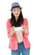 © vectorfusionart - Digital png photo of happy caucasian woman in hat, using smartphone on transparent background