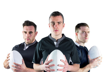 Poster - Digital png photo of three caucasian football players holding rugby balls on transparent background