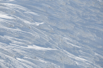 Wall Mural - natural abstract background pattern in frozen winter snow landscape