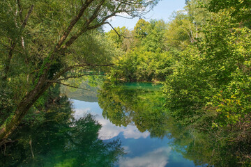 The River Una as it flows through Japod Islands, or Japodski Otoci, near Bihac in the Una National Park. Una-Sana Canton, Federation of Bosnia and Herzegovina. Early September