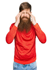 Wall Mural - Redhead man with long beard wearing casual clothes with hand on head for pain in head because stress. suffering migraine.