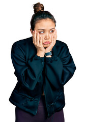 Wall Mural - Young hispanic girl wearing sportswear tired hands covering face, depression and sadness, upset and irritated for problem