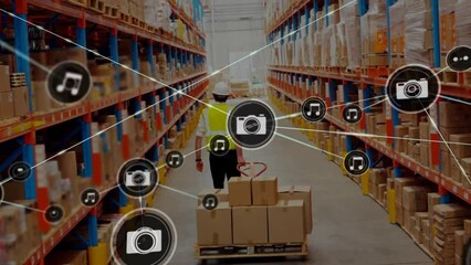 Poster - Animation of connected icons, caucasian workers moving cardboard boxes using hand truck in warehouse
