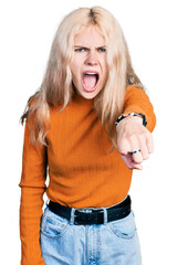 Canvas Print - Young caucasian woman wearing casual clothes pointing displeased and frustrated to the camera, angry and furious with you