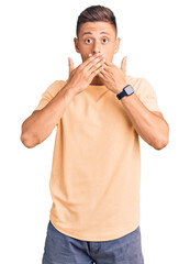Wall Mural - Young handsome man wearing casual clothes shocked covering mouth with hands for mistake. secret concept.