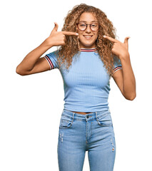 Sticker - Beautiful caucasian teenager girl wearing casual clothes and glasses smiling cheerful showing and pointing with fingers teeth and mouth. dental health concept.