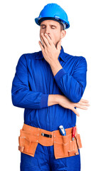 Sticker - Young handsome man wearing worker uniform and hardhat bored yawning tired covering mouth with hand. restless and sleepiness.