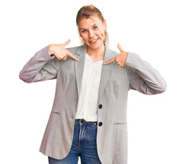 Wall Mural - Young beautiful blonde woman wearing elegant jacket looking confident with smile on face, pointing oneself with fingers proud and happy.