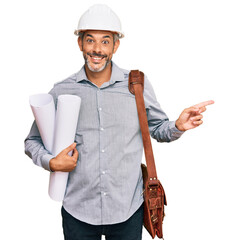 Poster - Middle age grey-haired man wearing safety helmet holding blueprints smiling happy pointing with hand and finger to the side