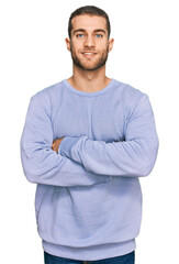 Sticker - Young caucasian man wearing casual clothes happy face smiling with crossed arms looking at the camera. positive person.