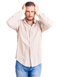 © Krakenimages.com - Young handsome caucasian man wearing casual clothes suffering from headache desperate and stressed because pain and migraine. hands on head.