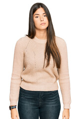 Sticker - Young brunette woman wearing casual winter sweater looking sleepy and tired, exhausted for fatigue and hangover, lazy eyes in the morning.