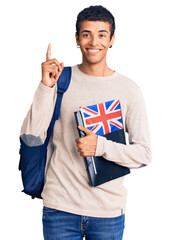 Poster - Young african amercian man wearing student backpack holding binder and uk flag surprised with an idea or question pointing finger with happy face, number one