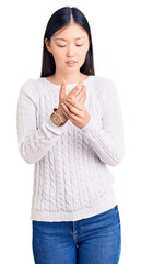 Sticker - Young beautiful chinese woman wearing casual sweater suffering pain on hands and fingers, arthritis inflammation