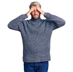 Canvas Print - Young handsome blond man wearing casual sweater suffering from headache desperate and stressed because pain and migraine. hands on head.