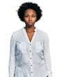 © Krakenimages.com - African american woman with afro hair wearing casual white t shirt depressed and worry for distress, crying angry and afraid. sad expression.