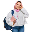 © Krakenimages.com - Hispanic woman with pink hair wearing student backpack and headphones smiling doing phone gesture with hand and fingers like talking on the telephone. communicating concepts.
