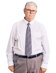 Sticker - Senior grey-haired man wearing business clothes depressed and worry for distress, crying angry and afraid. sad expression.