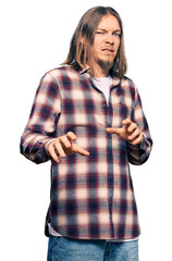 Sticker - Handsome caucasian man with long hair wearing hipster shirt disgusted expression, displeased and fearful doing disgust face because aversion reaction. with hands raised