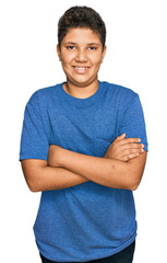 Sticker - Teenager hispanic boy wearing casual clothes happy face smiling with crossed arms looking at the camera. positive person.