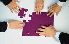 Top View Panorama Banner Of Business Team Assembling Jigsaw Puzzle Over Table Symbolize Business Partnership And Collective Teamwork For HR Recruitment And Job Seeker Background. Shrewd