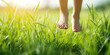 Cute Young Happy Girl.A young girl barefoot on the green grass connecting with nature.
