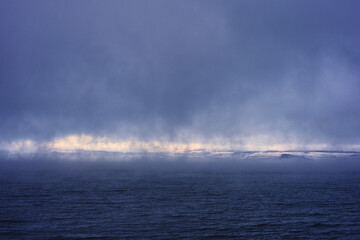 Wall Mural - Lake Mjosa with view towards rural Ringsaaker i misty day in December.