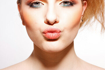 Portrait of beautiful blonde woman on a white background