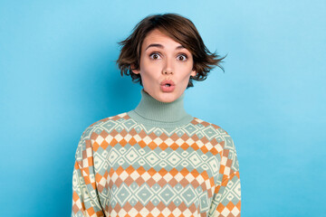 Wall Mural - Photo of impressed speechless young lady pouted lips staring cant believe news isolated on blue color background