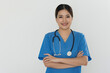 © Songsak C - Portrait of a young attractive doctor standing and having her arms crossed.
