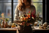 Fototapeta  - Young woman working in a flower shop flower decoration for sale