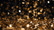 Blurry golden and white fairy string lights in dark night creating beautiful bokeh effect with glowing circles or shiny dots