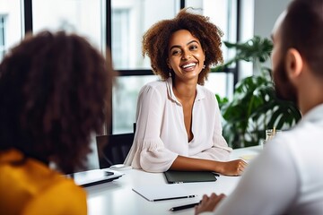 Wall Mural - Female designer has a meeting with team, African American business woman at diverse team office meeting. Smiling professional businesswoman company employee leader with tablet sitting in board room