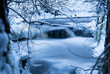 Natural stream with fresh snow