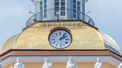 Wall Mural - Timelapse of Admiralty Building Tower Clock in St. Petersburg, Russia. Close-Up View of Clock on Tower's Upper Part with Blue Cloudy Sky Background