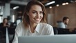 © Adi - Close up portrait of young beautiful woman smiling while working with laptop in office
