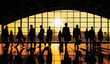 Silhouettes of people at busy station or terminal hall, orange yellow sunset sky background, wide banner, Generative AI