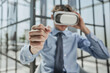 © Katsiaryna - businessman in virtual reality headset in the office