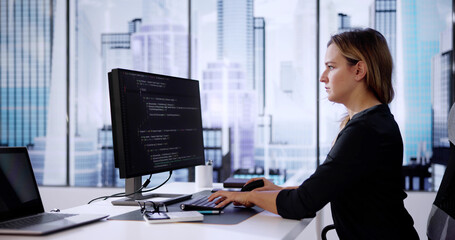 Web Developer Coding On Computer