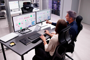 Two People Engaging in Computer Engineering