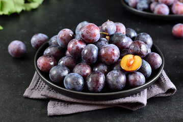 Wall Mural - Fresh plums on plate