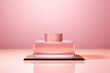 © Marina_Nov - Podium for demonstration of promotional products. Podium layout for perfumes or cosmetics on pink background. Vial mock up. Copy space.